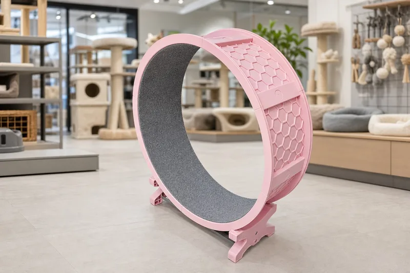 Pink plastic cat exercise wheel displayed in a pet supplies showroom